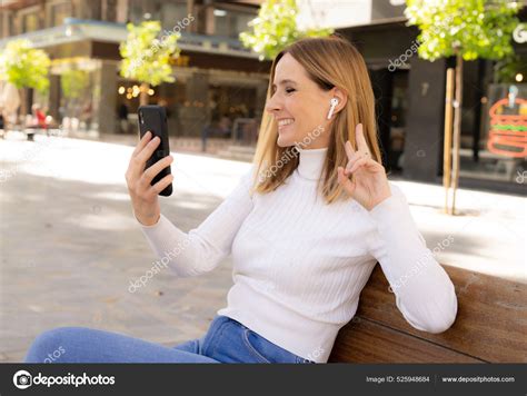 Smiling Happy Woman Talking Mobile Phone Sitting Outdoors City Stock