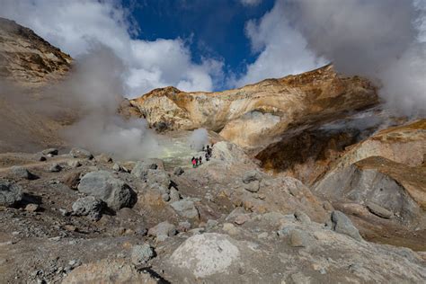 People Hiking in Mountains near Hot Springs · Free Stock Photo