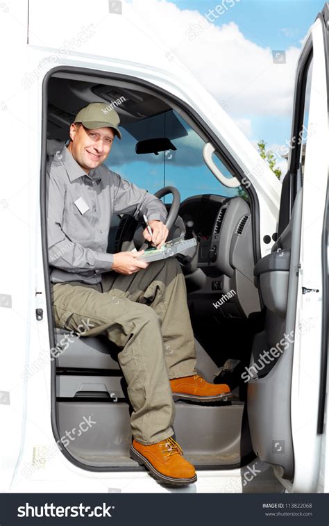 Smiling Truck Driver In The Car Delivery Cargo Service Stock Photo