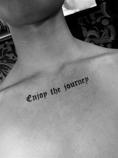 A Man With A Tattoo Saying Enjoy The Journey On His Chest