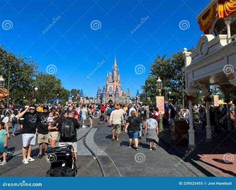 People Walking Toward Cinderella Castle In Walt Disney World Magic Kingdom In Orlando Florida