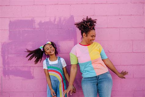 Laughing Mother And Daughter With Wild Hair By Stocksy Contributor