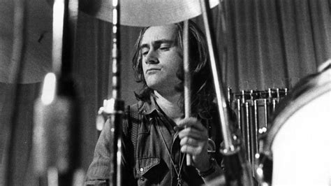 A Picture Of Phil Collins Drumming For Genesis In The 1970s