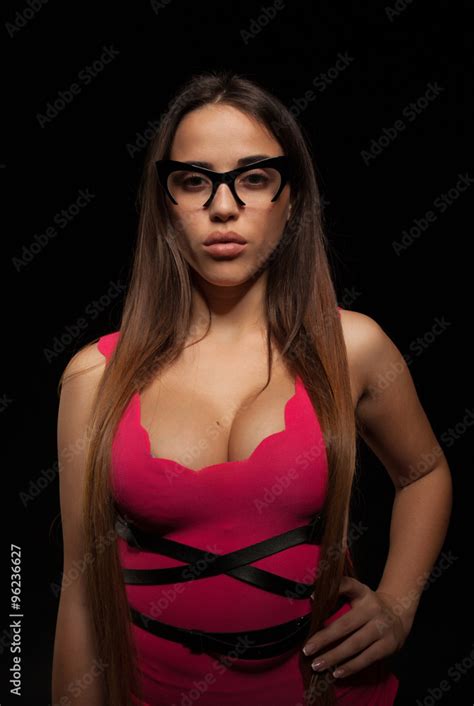 Sexy Elegant Businesswoman Posing Over Black Background Looking At