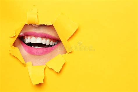 Lips Of Young Woman With Beautiful Lipstick Visible Through Hole In