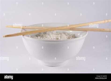 Bowl Of White Rice With Chopsticks