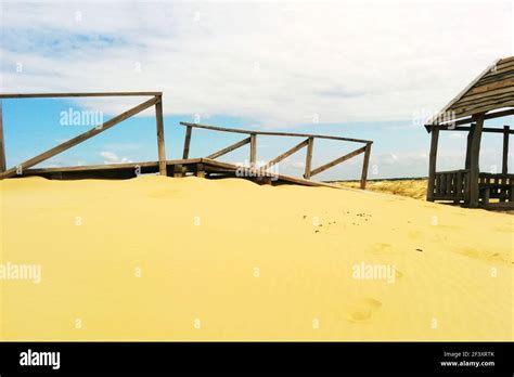 Desert Landscape Wooden Structures On Sand Stock Photo Alamy