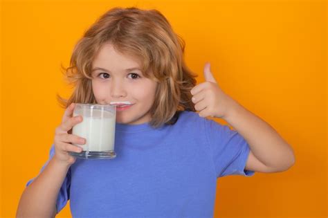 Premium Photo Dairy Milk Little Child Drinking Milk Kid With Glass Of