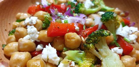 Broccoli Chickpeas Feta Salad Spoon And Hand