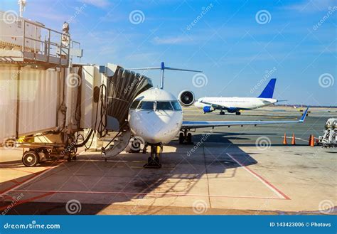 Front View Of Landed Airplane In A Terminal Of At The John F Kennedy