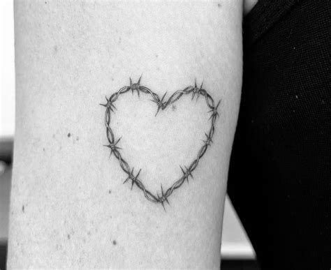 Barbed Wire Heart Tattooed On The Upper Arm