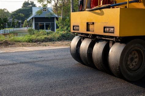 Heavy Vibration Yellow Steamroller Or Soil Compactor Working On Hot Mix