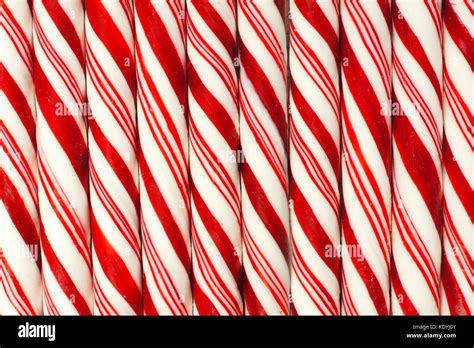 Full background of red and white striped Christmas candy canes Stock ...