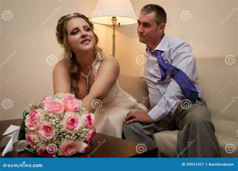 Bride And Groom Sitting On A Sofa Stock Image Image Of Bride