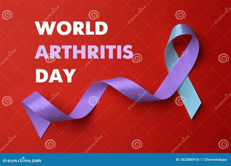 World Arthritis Day Blue And Purple Awareness Ribbon On Red Background