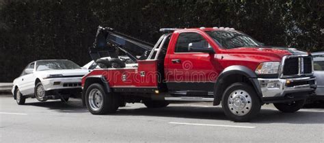 Red Tow Truck Hauling Away White Car Stock Photo Image Of Automobile