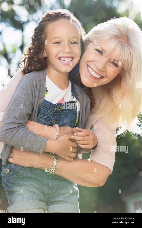 Portrait Smiling Grandmother And Granddaughter Hugging Stock Photo Alamy