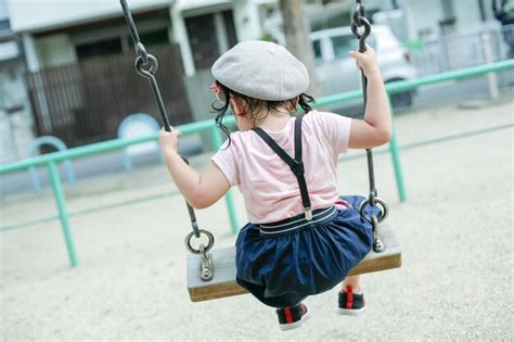 Premium Photo Full Length Of Girl Sitting On Swing