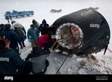 Russian Support Personnel Work To Help Get Crew Members Out Of The