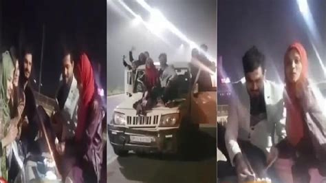 बोलेरो के बोनट पर बैठ महिला ने काटा केक स्टंटबाजी का Video वायरल Stunt At Nh9 Amroha Birthday