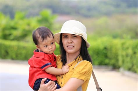 Premium Photo Portrait Of Mother With Son Standing Outdoors