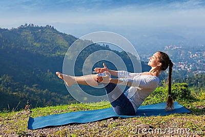 Woman Doing Ashtanga Vinyasa Yoga Asana Navasana Boat Pose Stock