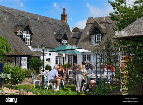 Alfresco Eating Outside A Riverside Pub With Thatched Roof Horning