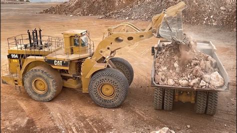 Unleashing Power Massive Caterpillar 994 Wheel Loader Loading Caterpillar 777f Dumpers Video