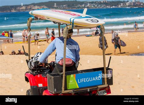 Surf Rescue Lifeguard In His Surf Beach Buggy On North Curl Curl Beach