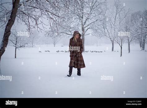 Woman Walks In Snow Storm Stock Photo Alamy