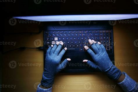 Hacker Hand Stealing Data From Laptop Top Down Stock Photo At