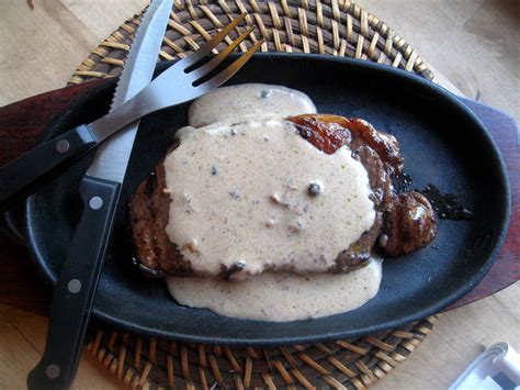 grilled strip loin  black peppercorn sauce