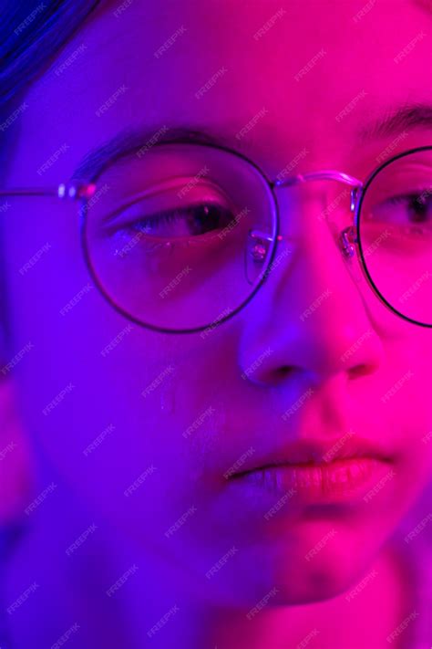 Free Photo Cute Girl With Glasses Crying In Neon Light Face Closeup