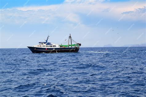 Premium Photo | Fishing trawler professional boat working