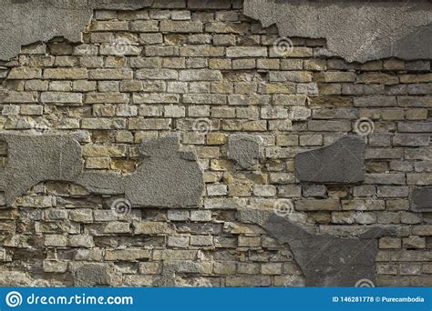 Pared De Ladrillo Resistida Vieja Agrietada Para El Fondo Foto De