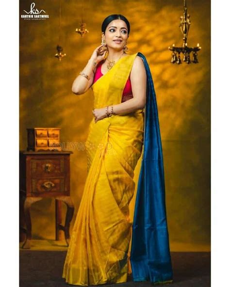 Actress Janani Iyer In A Traditional Yellow Saree Photoshoot Pictures