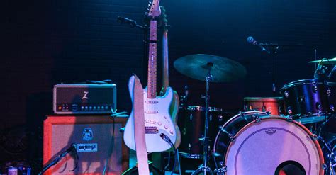 Photo Of Electric Guitar And Drum Set · Free Stock Photo