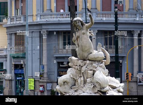 Mermaid Fountain In The Centre Of An Urban Intersection Naples