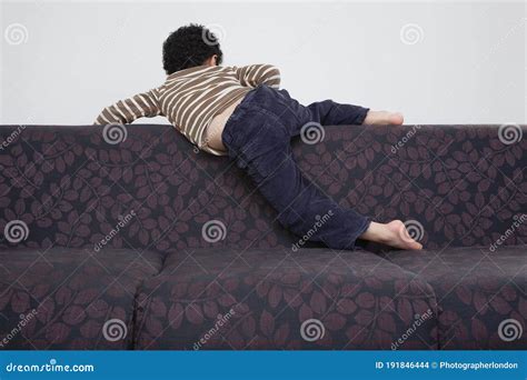 Boy 5 6 Climbing Over Sofa Stock Photo Image Of Active Years