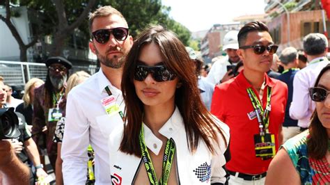 Emily Ratajkowski Wears A Racing Suit And Bikini At Grand Prix