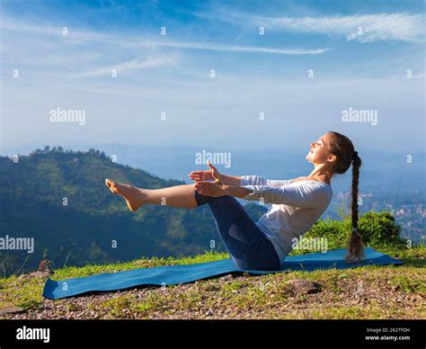 Woman Doing Ashtanga Vinyasa Yoga Asana Navasana Boat Pose Stock