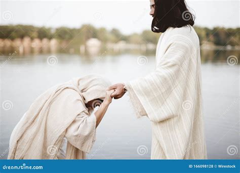 Shallow Focus Shot Of A Female Grabbing The Hand Of Jesus Christ For Healing And Help Stock ...