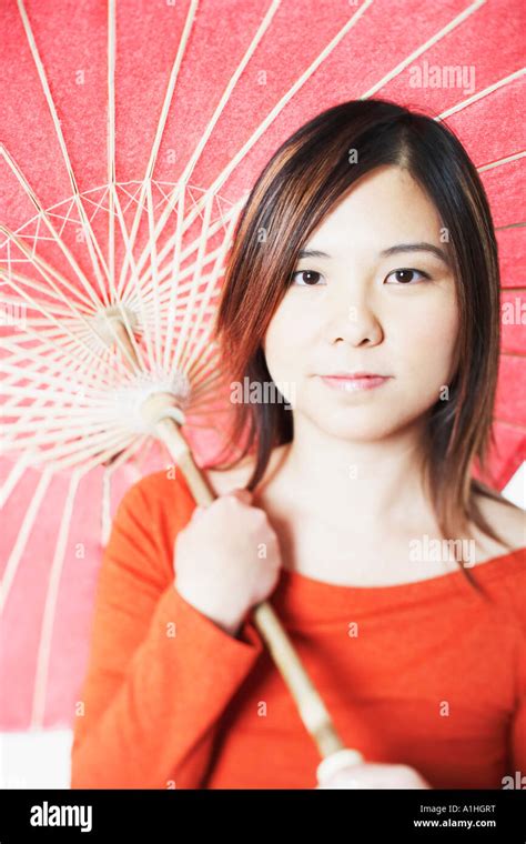 Portrait Of A Mid Adult Woman Holding A Parasol Stock Photo Alamy