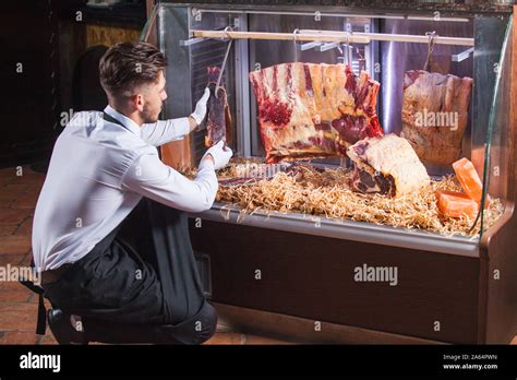 Display Of Dry Aged Meat Steaks In Butchers Shop Or Restaurant In An