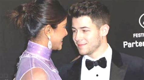 Nick Jonas Adjusts Priyanka Chopras Dress Shares Adorable Kiss