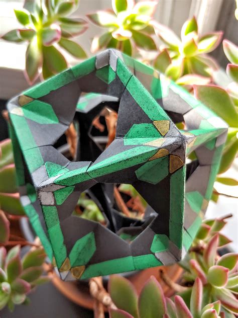 Rhombic dodecahedron with relief printed modules : r/origami