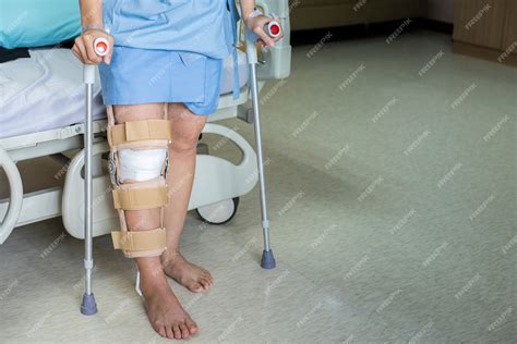 Premium Photo Patient Standing On Crutch In Hospital Ward Ware Knee