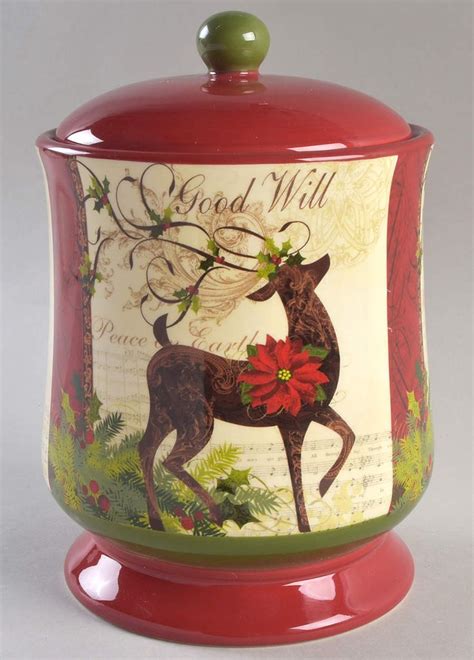 A Red Canister With A Deer And Poinsettis On It