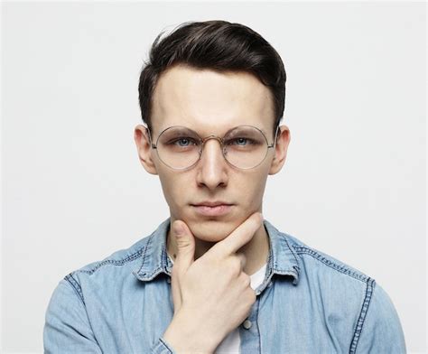 Premium Photo Portrait Of A Smart Young Man Wearing Eyeglasses