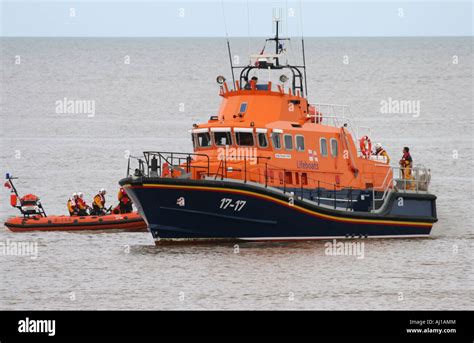 Severn Class Lifeboat And Dinghy Stock Photo Alamy